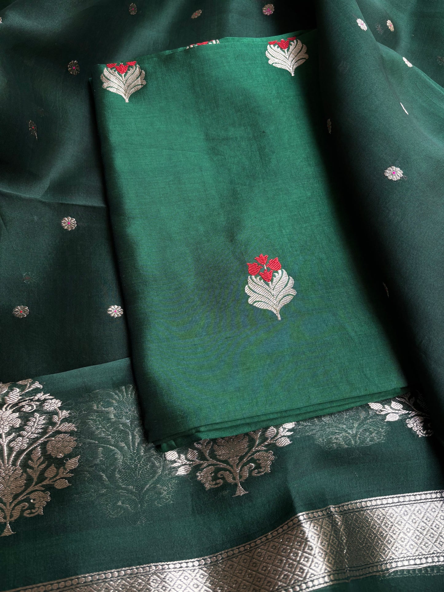 Bottle green chiniya silk kurta, kora silk dupatta, plain bottom.