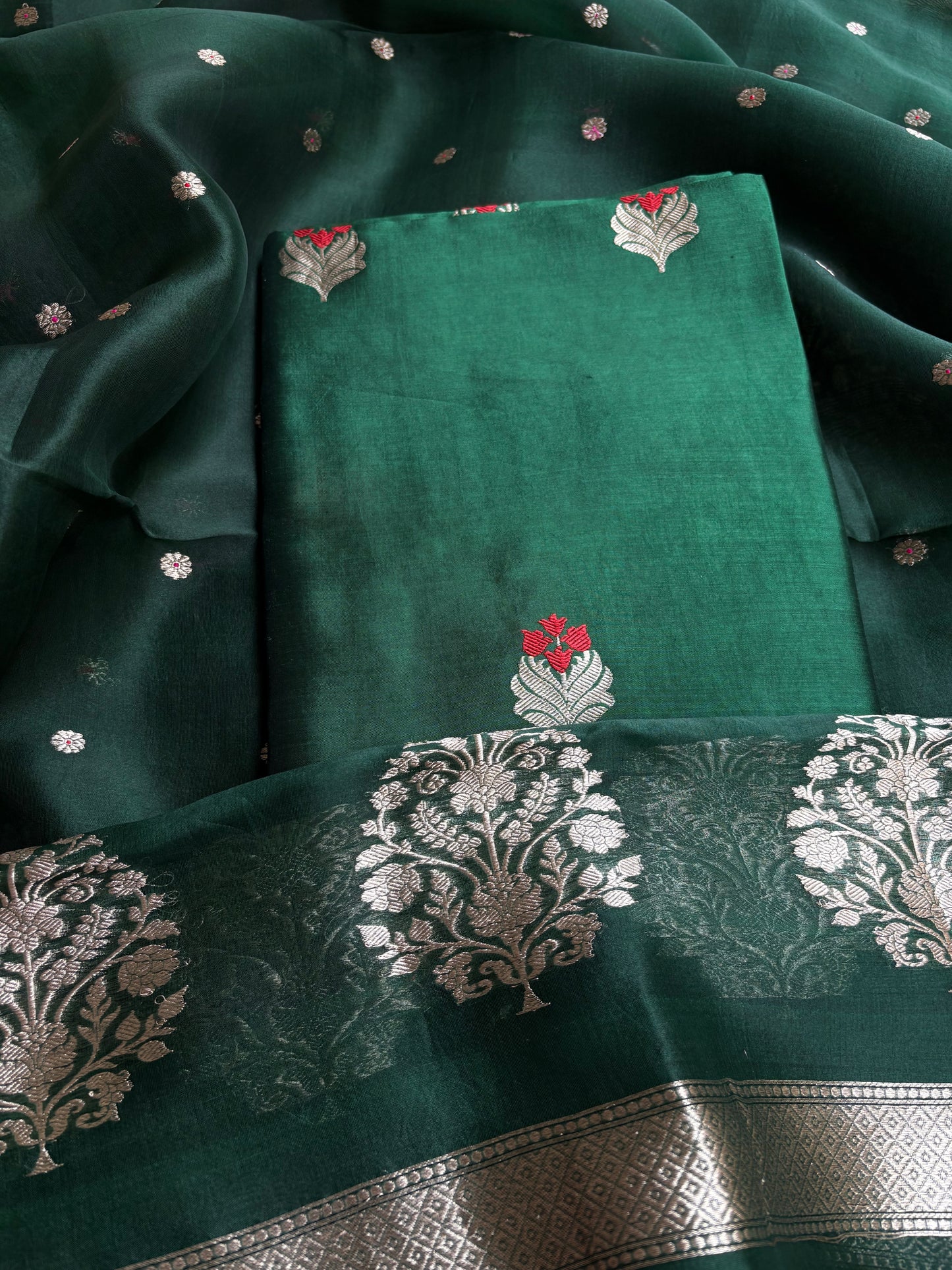 Bottle green chiniya silk kurta, kora silk dupatta, plain bottom.
