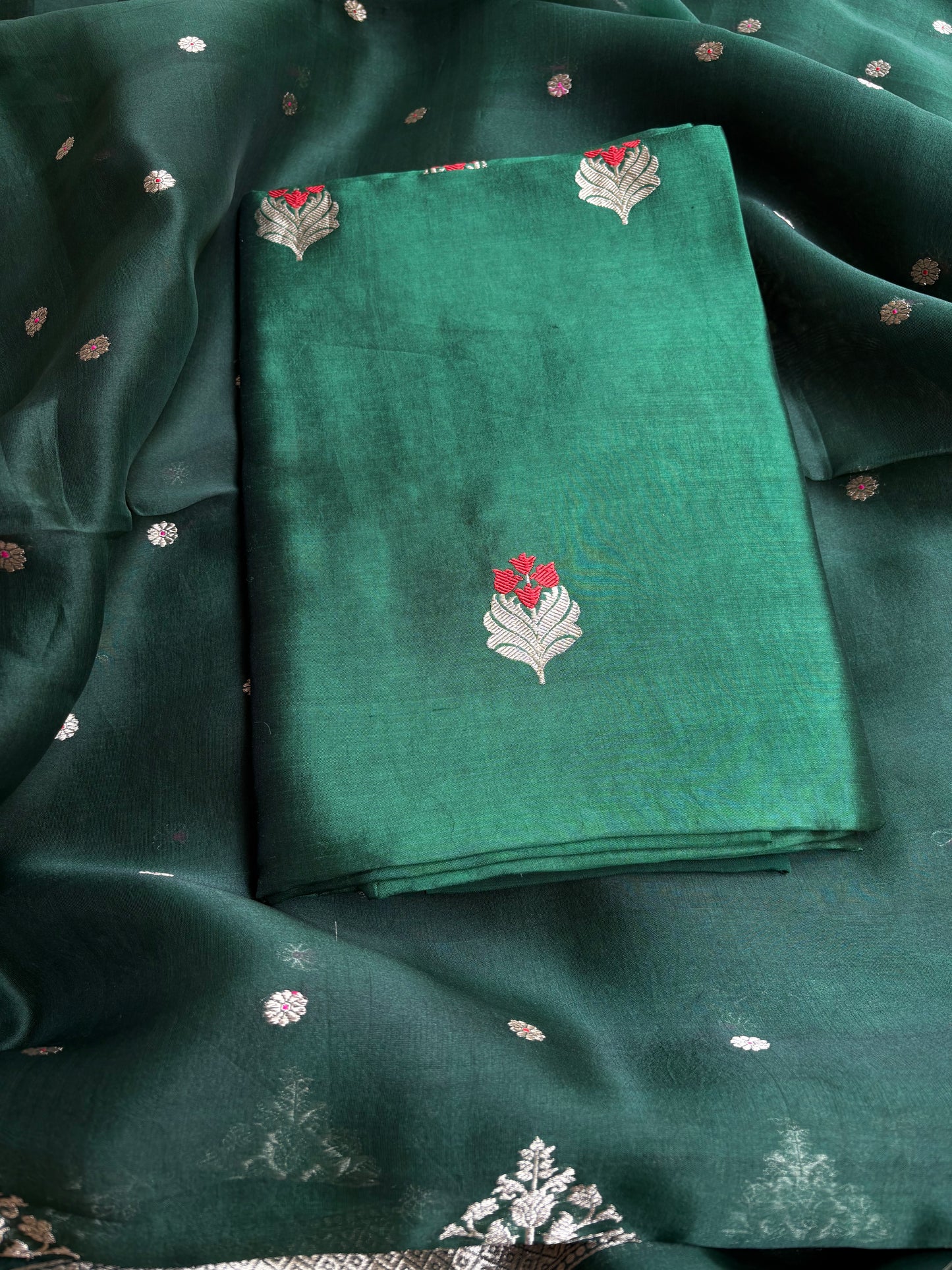 Bottle green chiniya silk kurta, kora silk dupatta, plain bottom.