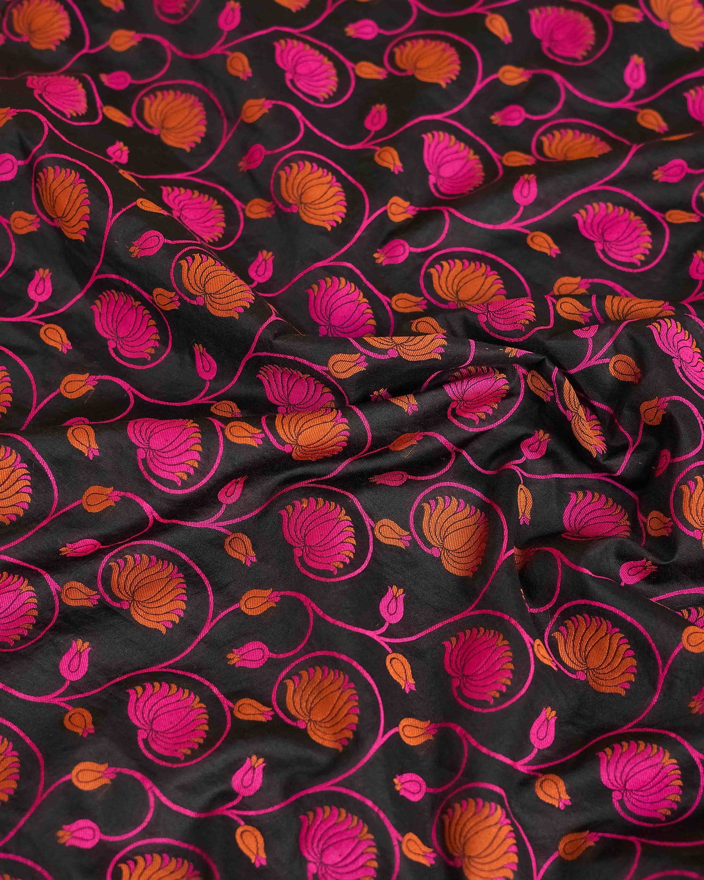 Black chanderi with pink meenadar bootis, jaal dupatta, plain bottom.