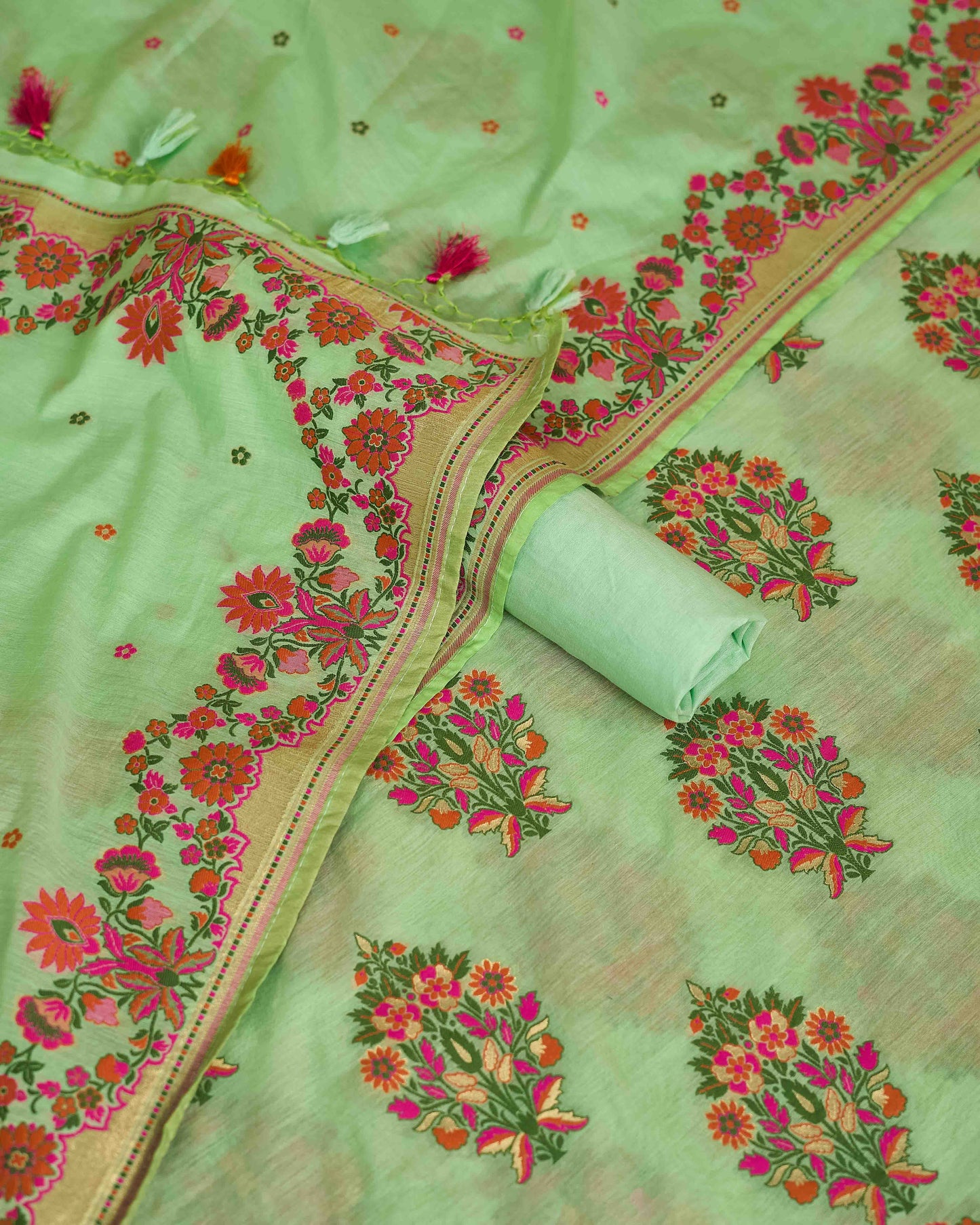 Green chanderi meendar kurta, dupatta and plain bottom.