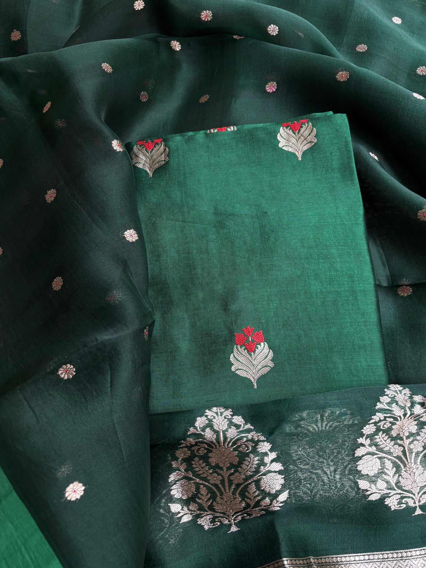 Bottle green chiniya silk kurta, kora silk dupatta, plain bottom.