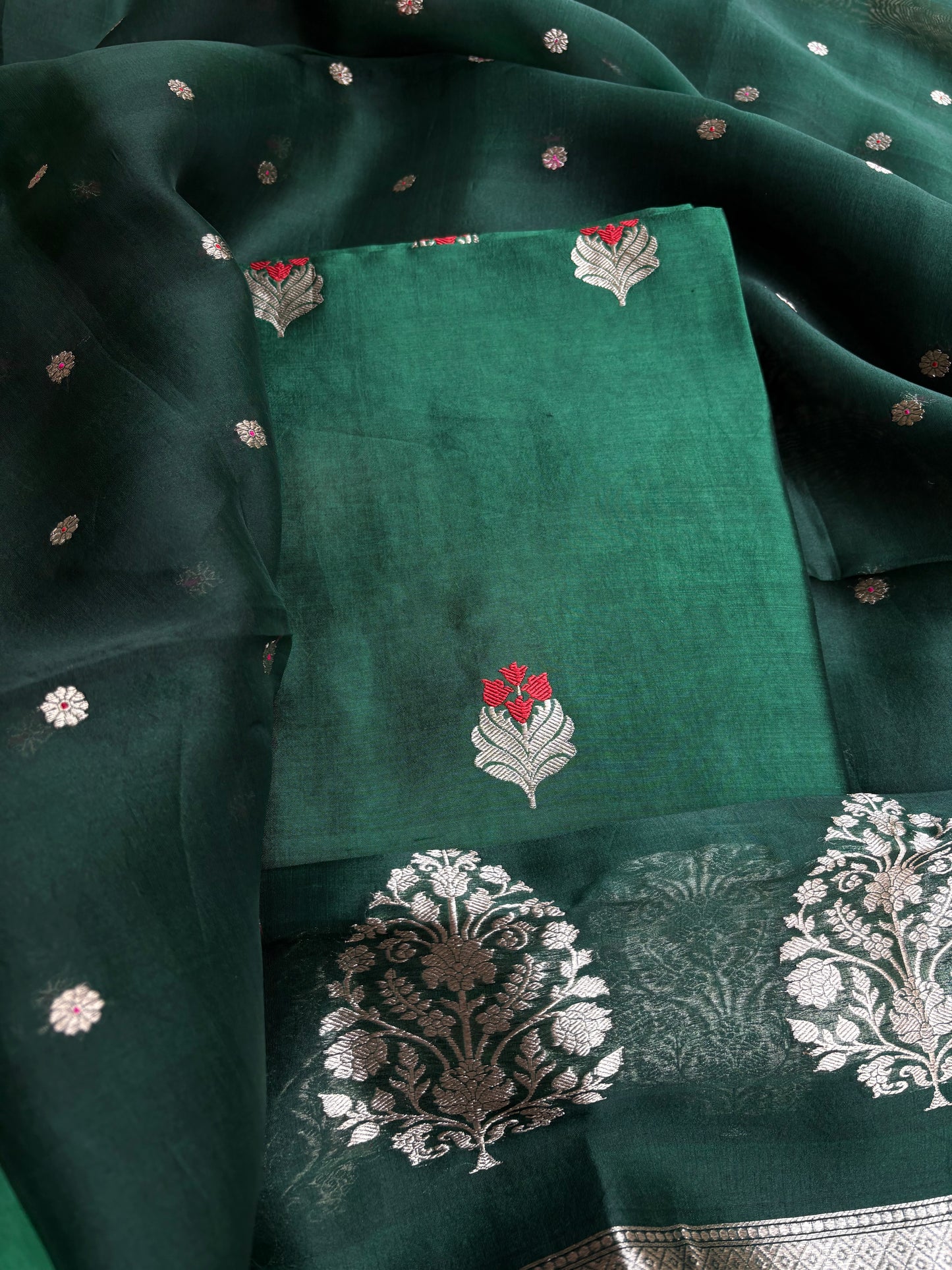 Bottle green chiniya silk kurta, kora silk dupatta, plain bottom.