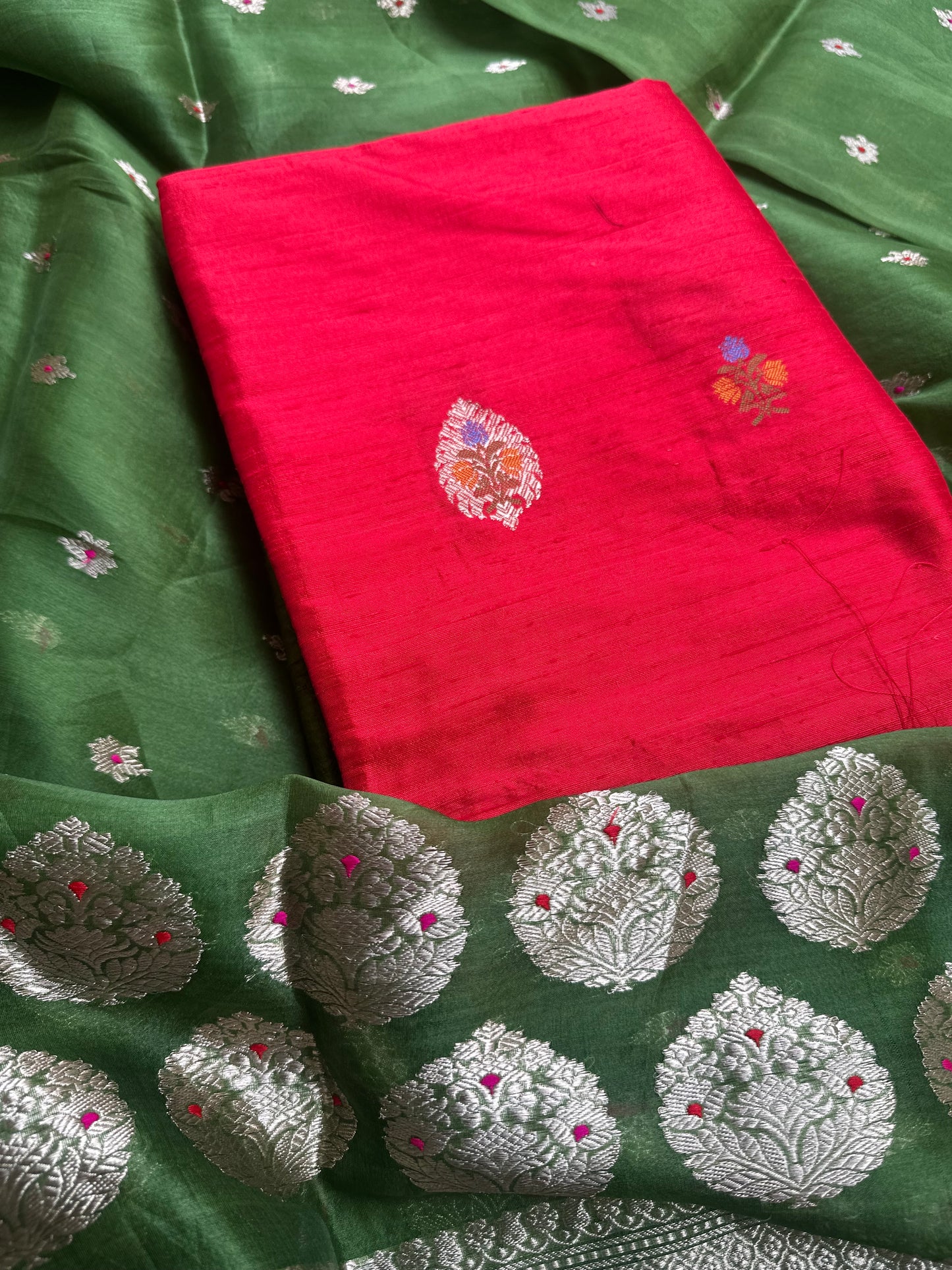 Red raw silk kurta, green kora silk dupatta, plain raw silk bottom