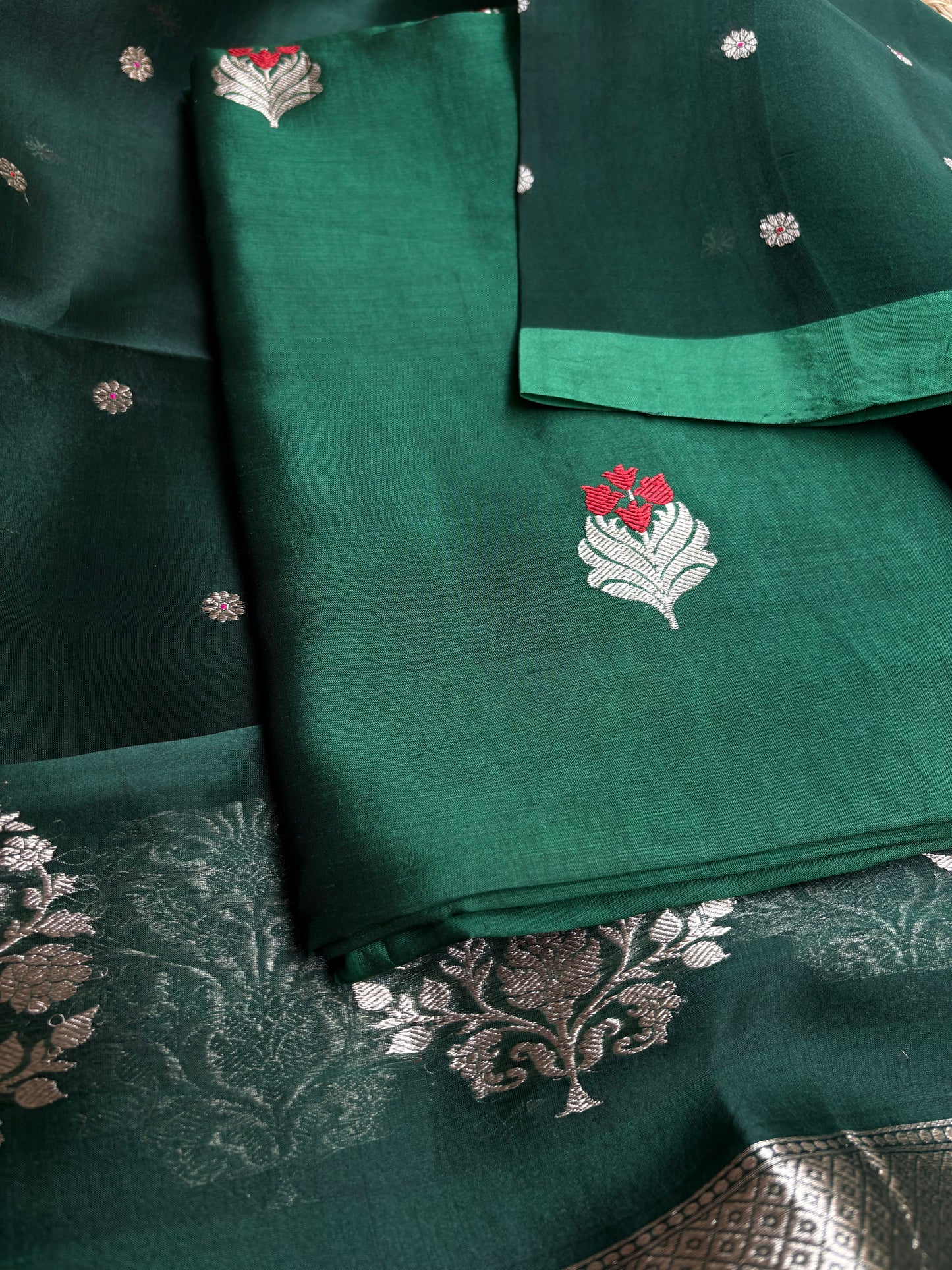 Bottle green chiniya silk kurta, kora silk dupatta, plain bottom.