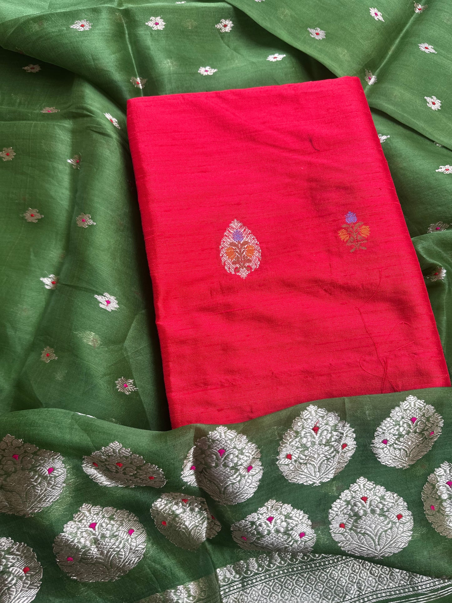 Red raw silk kurta, green kora silk dupatta, plain raw silk bottom