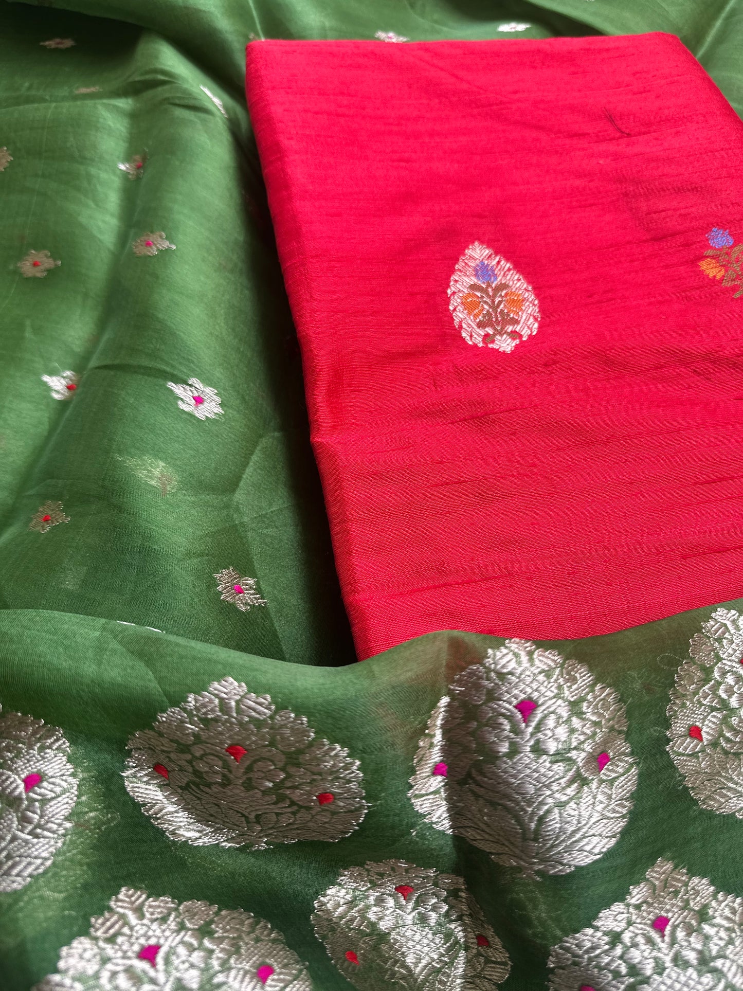 Red raw silk kurta, green kora silk dupatta, plain raw silk bottom