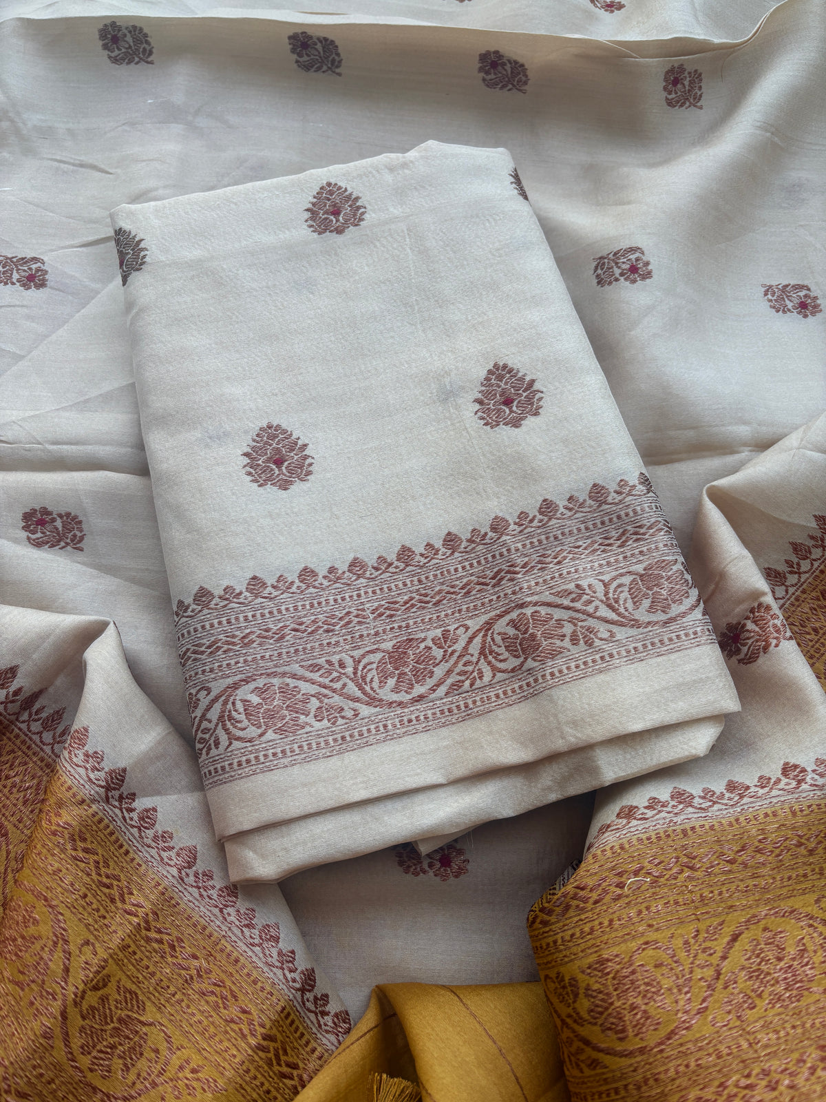Cream tussar suit with shaded yellow dupatta