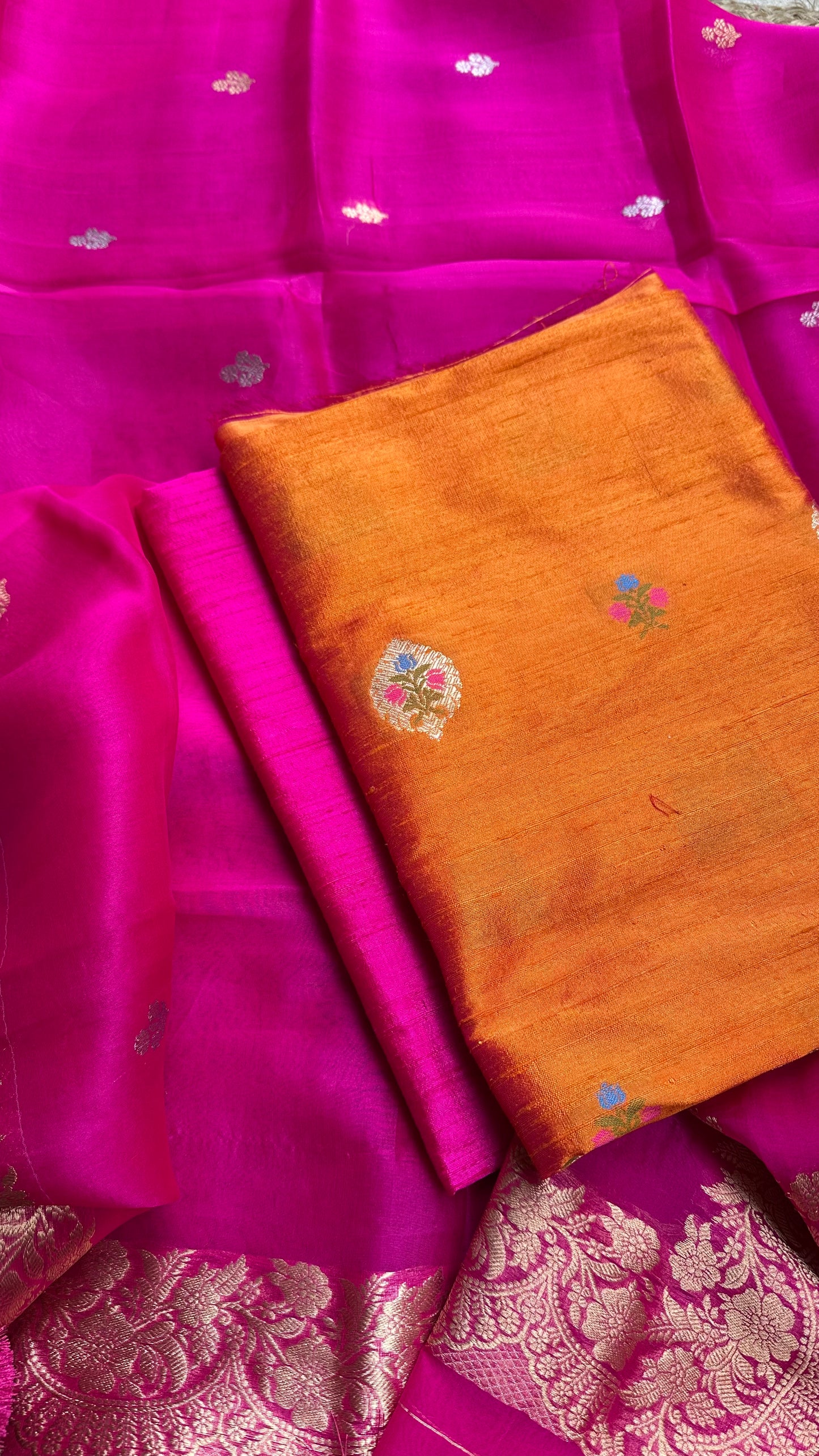Orange raw silk meendar kurta, pink kora silk dupatta, plain raw silk bottom