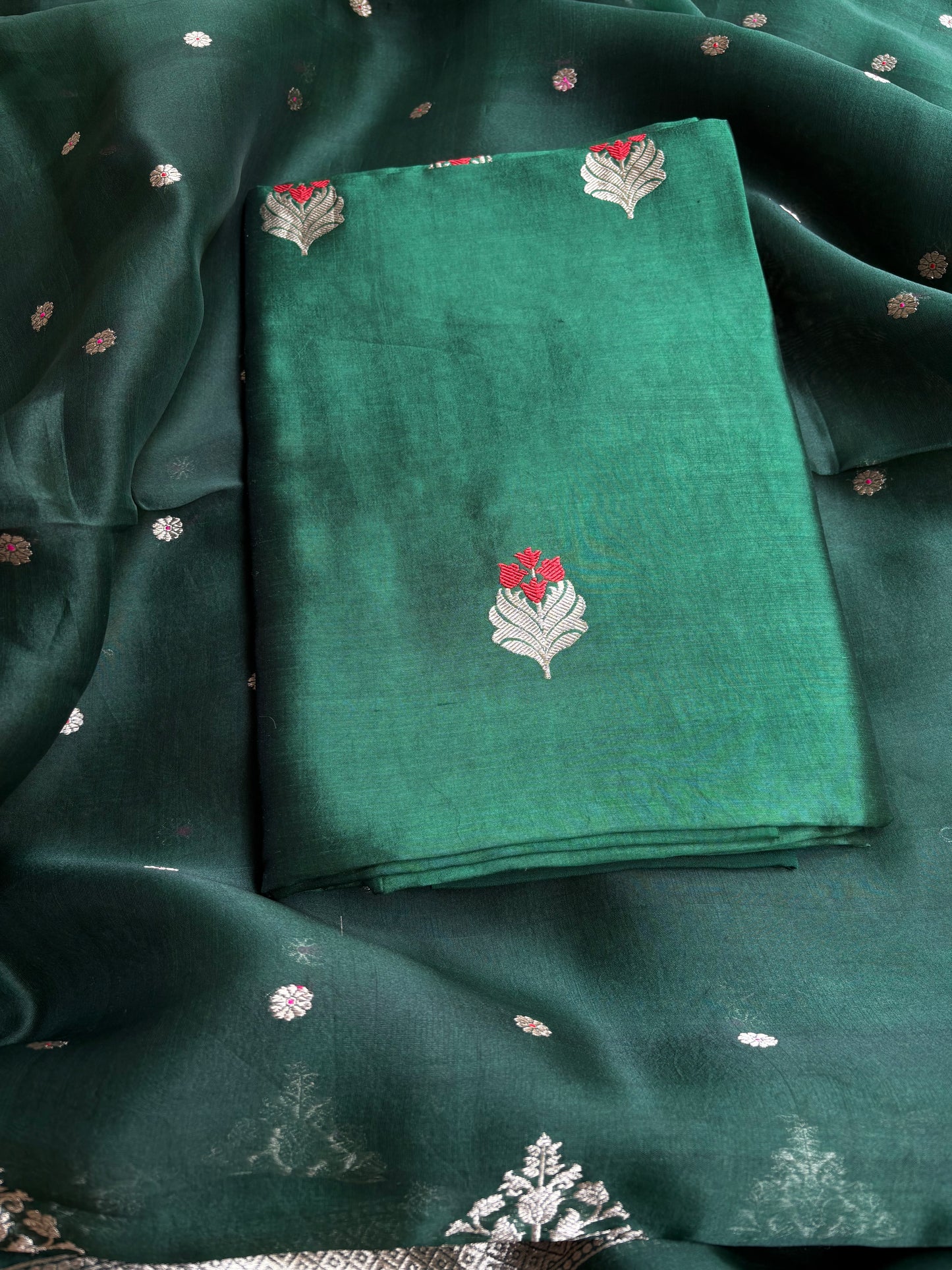 Bottle green chiniya silk kurta, kora silk dupatta, plain bottom.