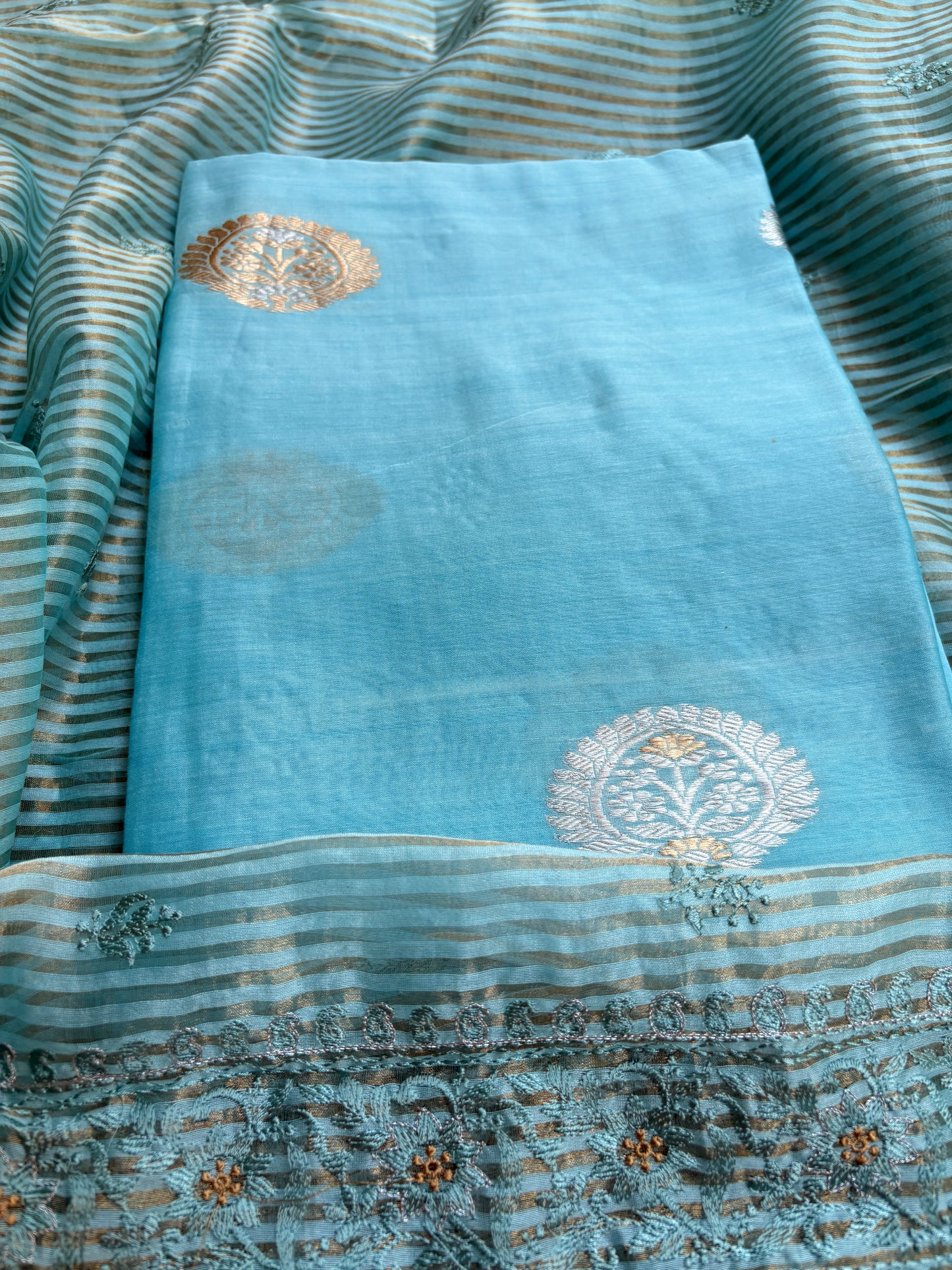 Blue handloom silk kurta, bottom tissue kadhwa dupatta.