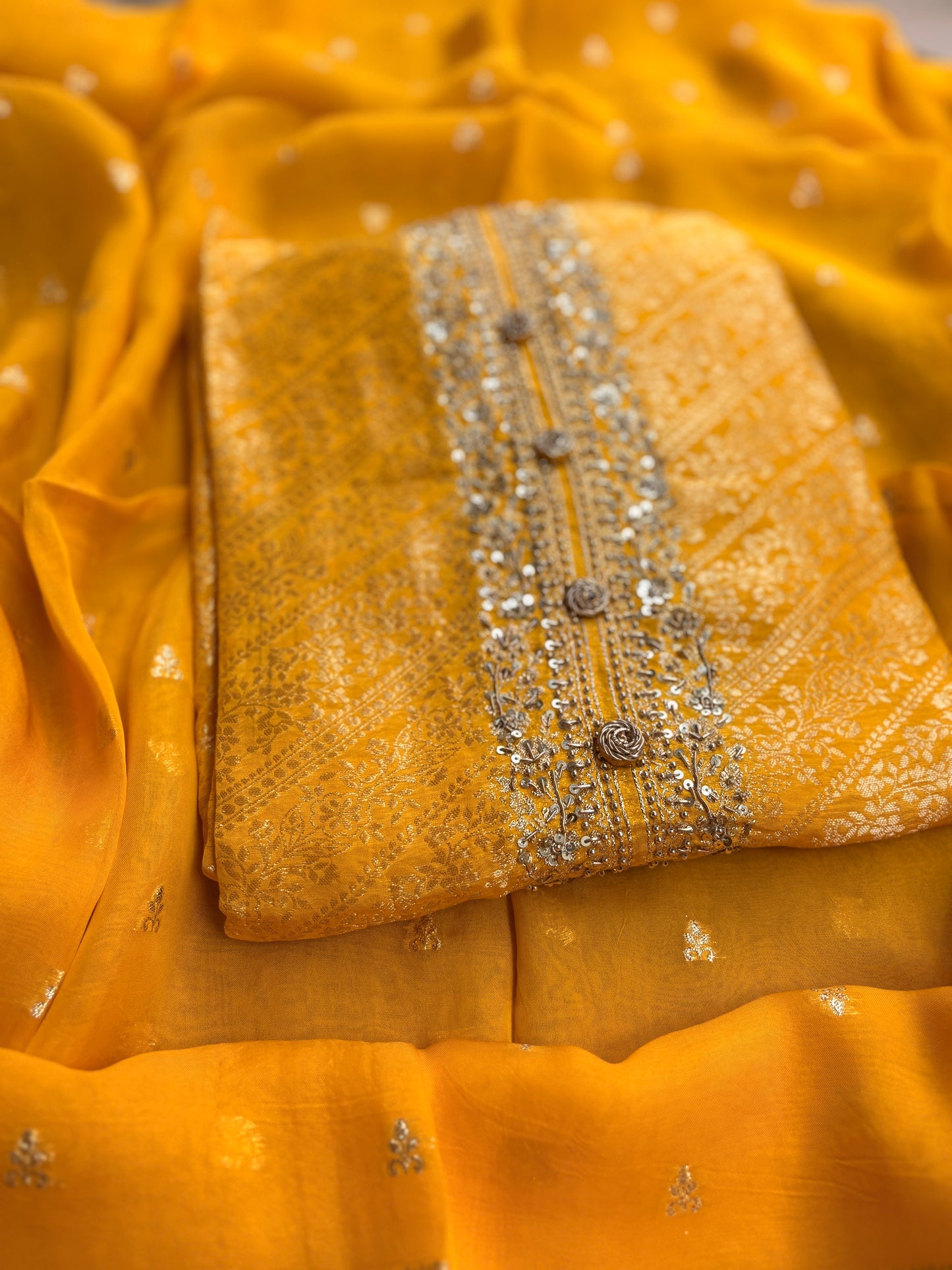 Yellow silk hand embroidered suit set.