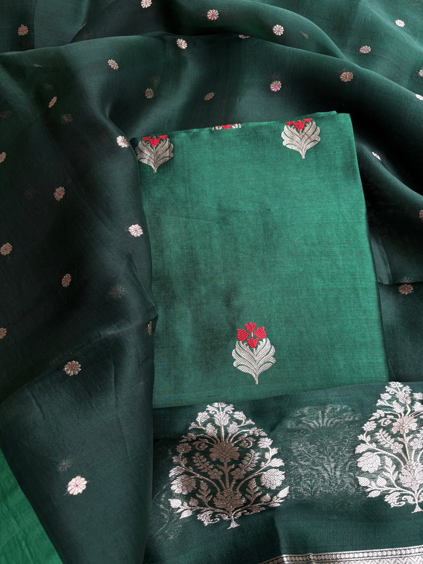 Bottle green chiniya silk kurta, kora silk dupatta, plain bottom.