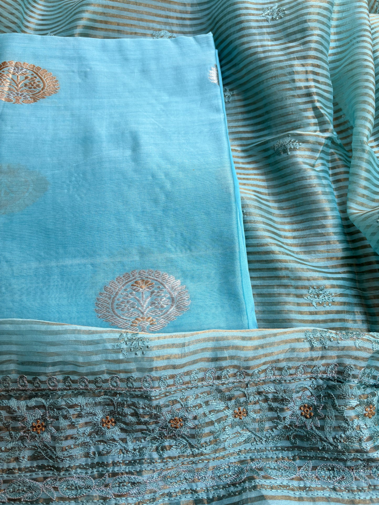 Blue handloom silk kurta, bottom tissue kadhwa dupatta.
