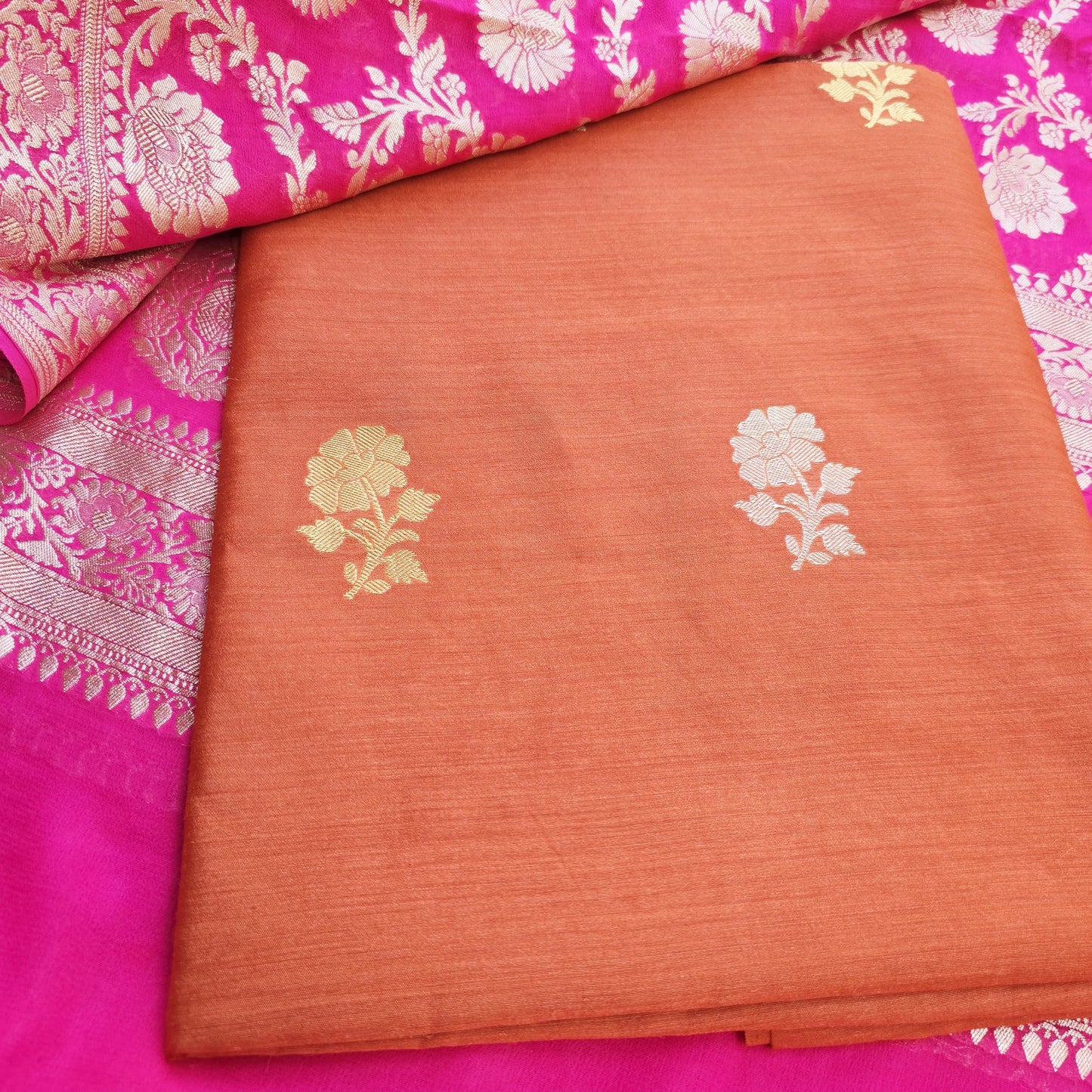 Rust orange moonga silk kurta, pink georgette dupatta