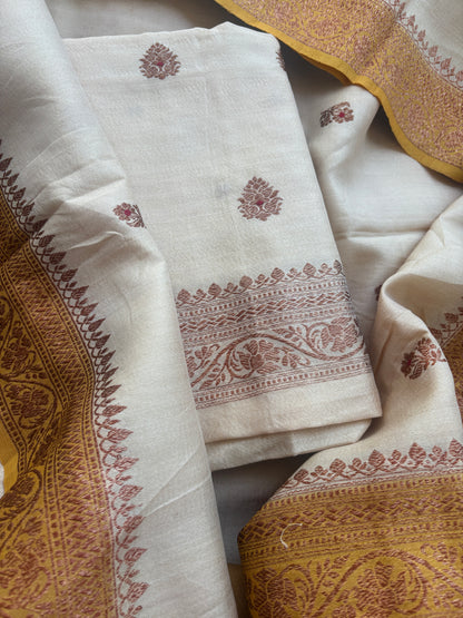 Cream tussar suit with shaded yellow dupatta