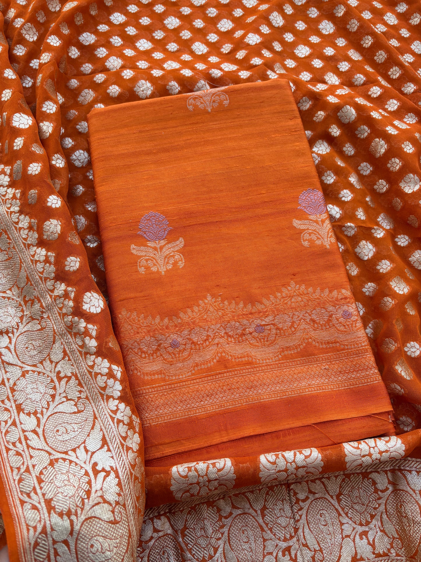 Rust raw silk kadhwa suit with Khaddi georgette dupatta