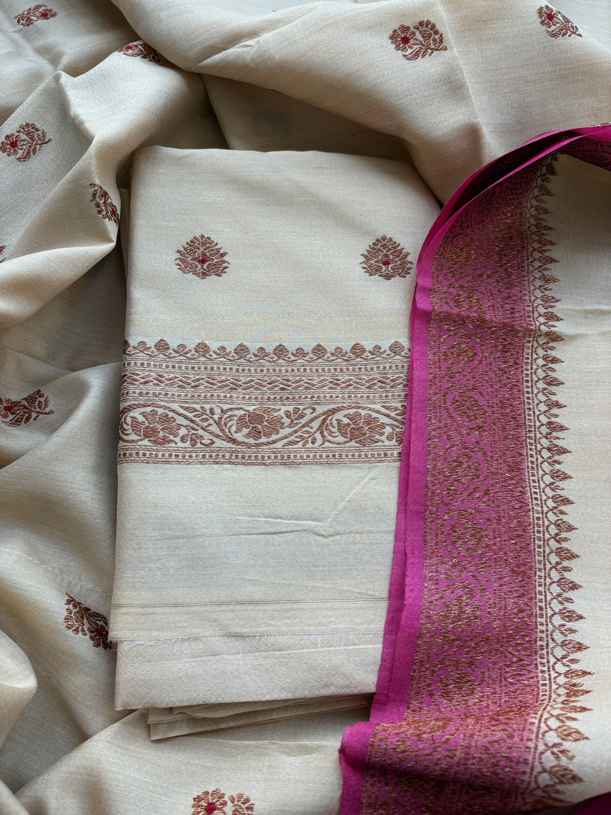 Cream tussar silk suit with pink shaded dupatta