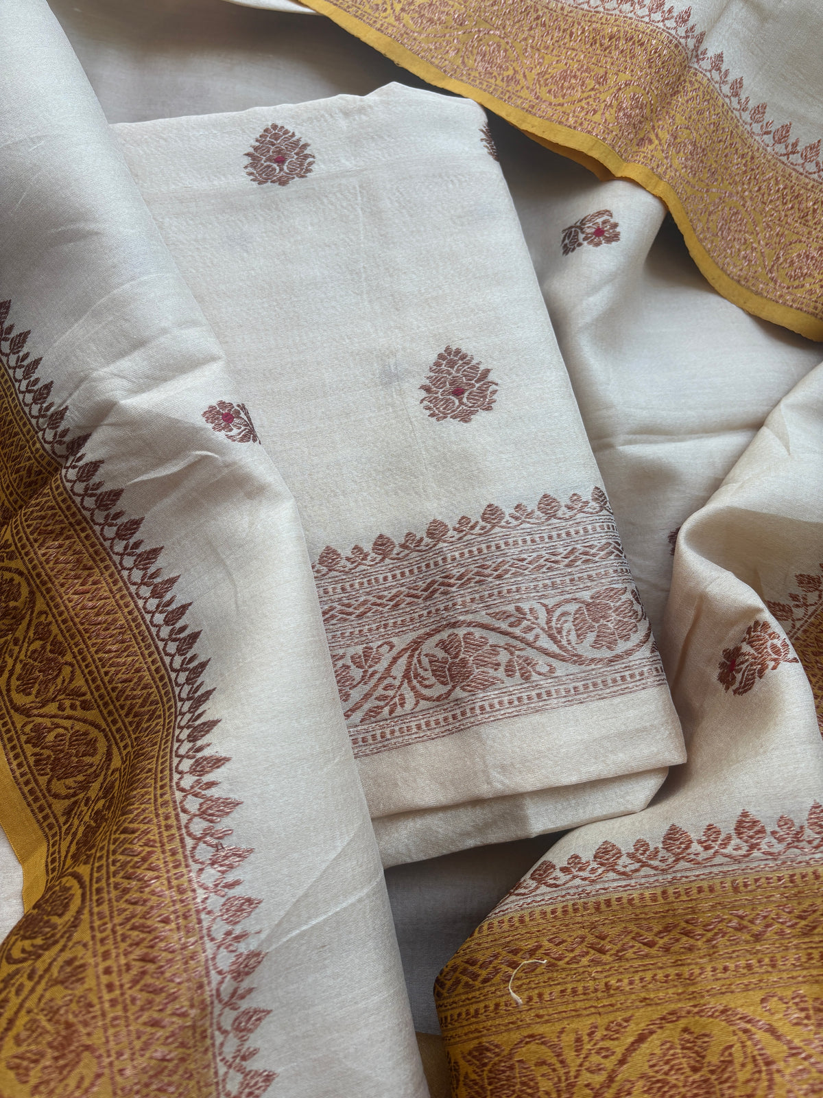 Cream tussar suit with shaded yellow dupatta