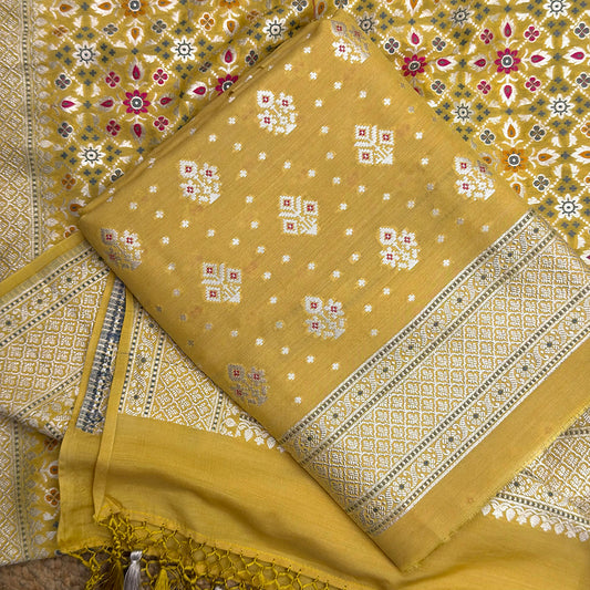 Yellow moonga silk suit with Patola weave dupatta