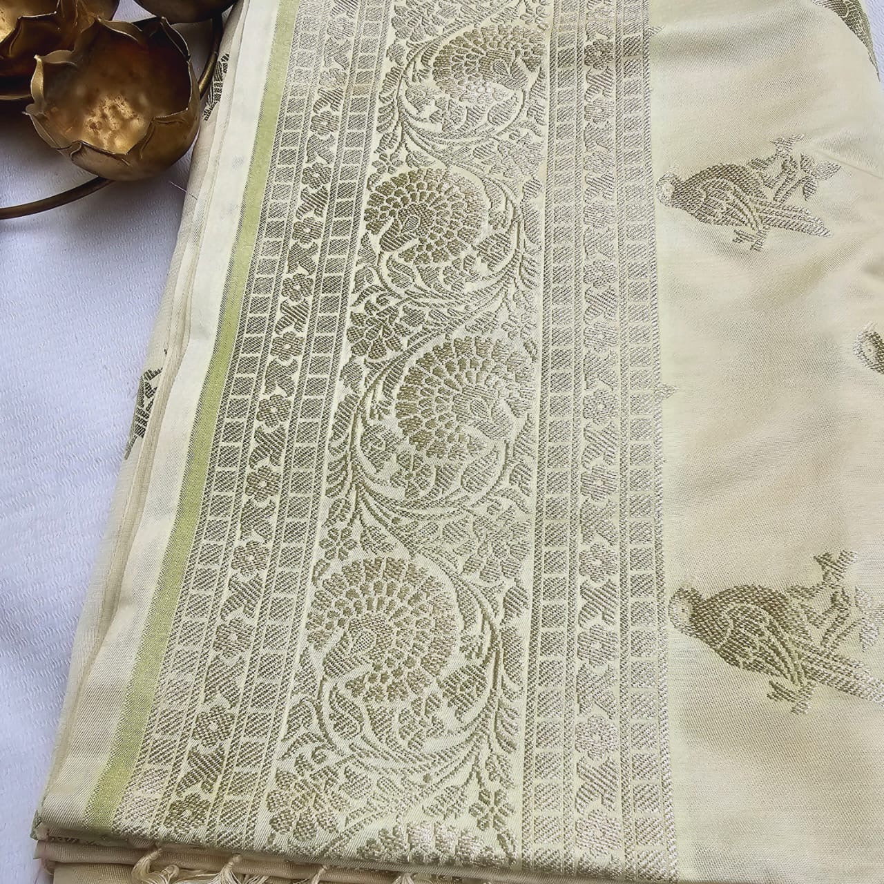 Cream base Mashru silk bird motif saree.