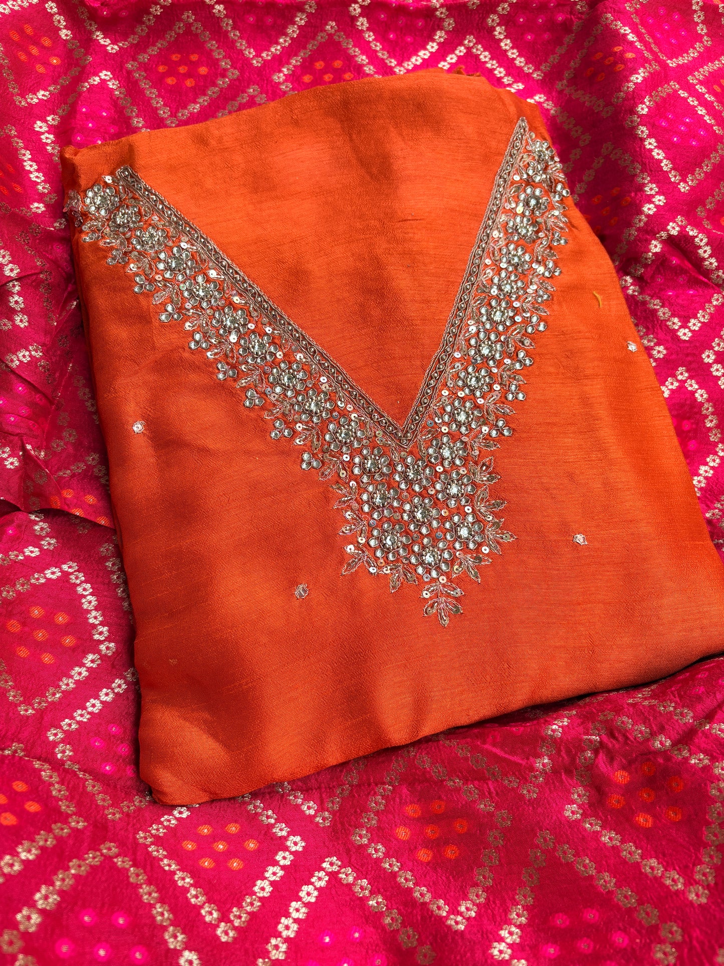 Orange hand embroidered kurta, red bandhani dupatta , plain bottom