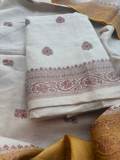 Cream tussar suit with shaded yellow dupatta