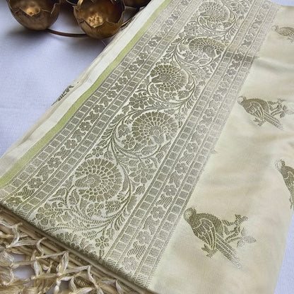 Cream base Mashru silk bird motif saree.