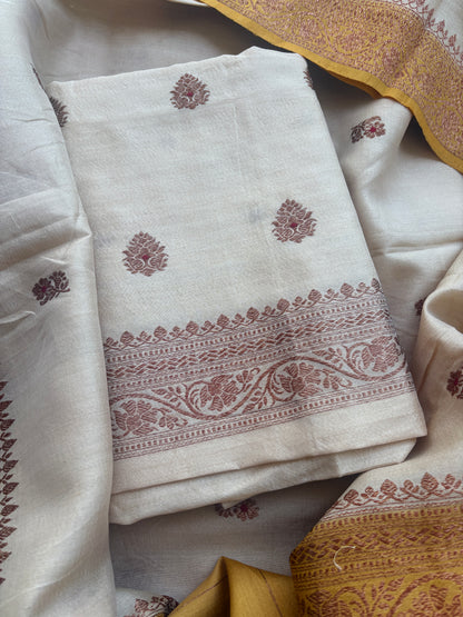 Cream tussar suit with shaded yellow dupatta