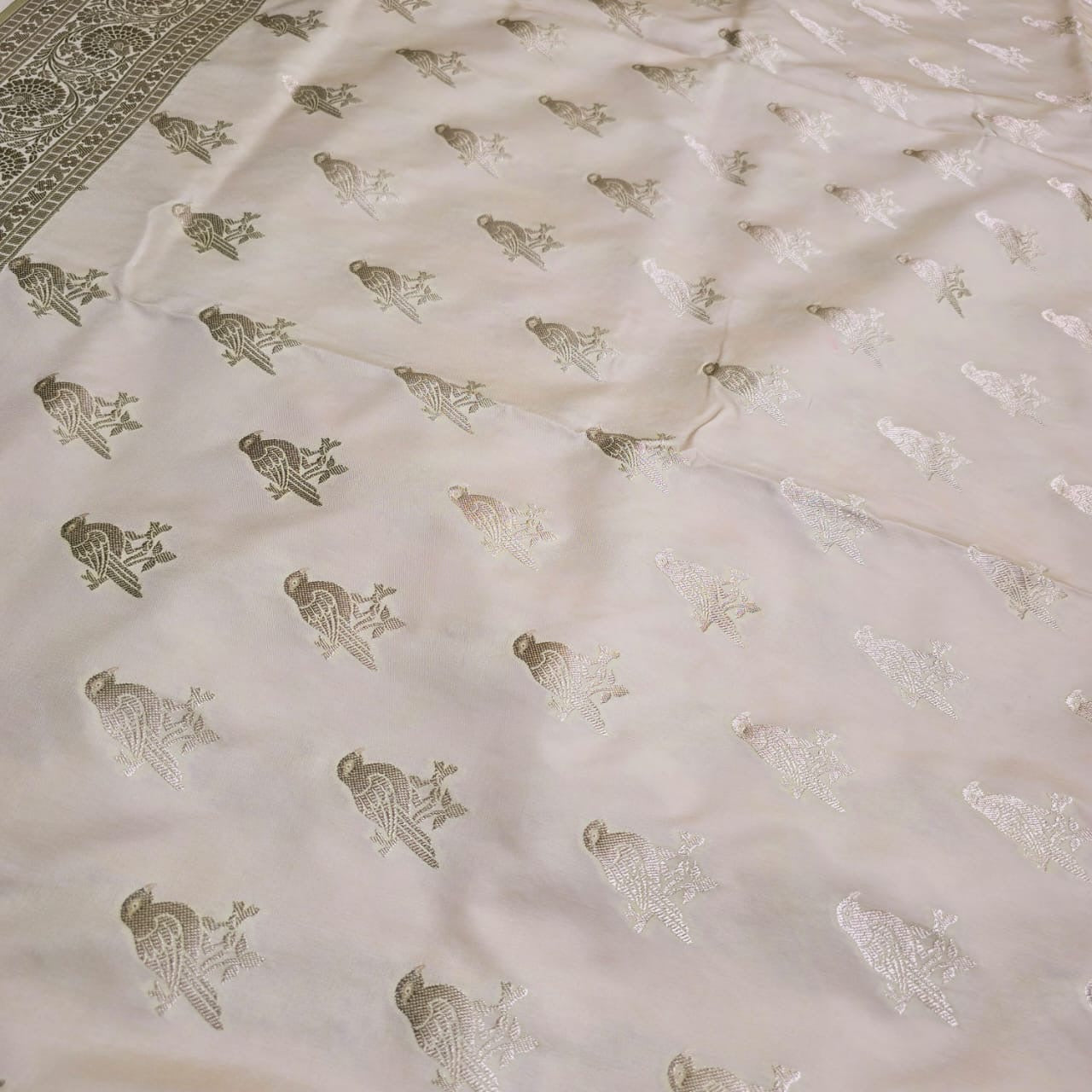 Cream base Mashru silk bird motif saree.