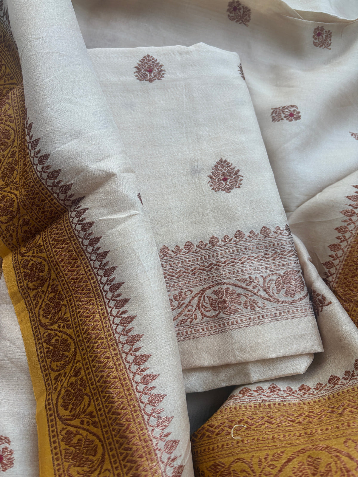 Cream tussar suit with shaded yellow dupatta