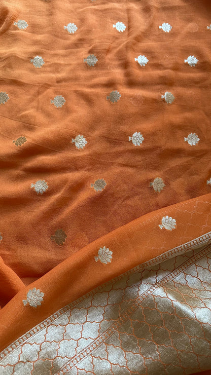 Orange kadhwa moonga silk kurta, moonga silk bottom and georgette dupatta.