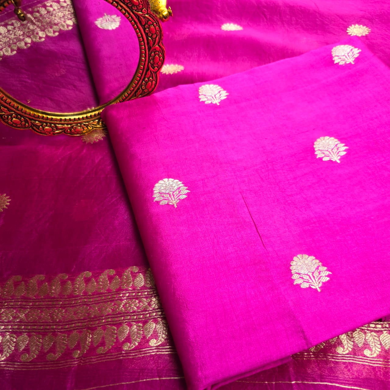 Rani pink chiniya kurta, kora silk dupatta and plain bottom.