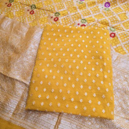 Yellow georgette Kurta with bandhani dupatta.